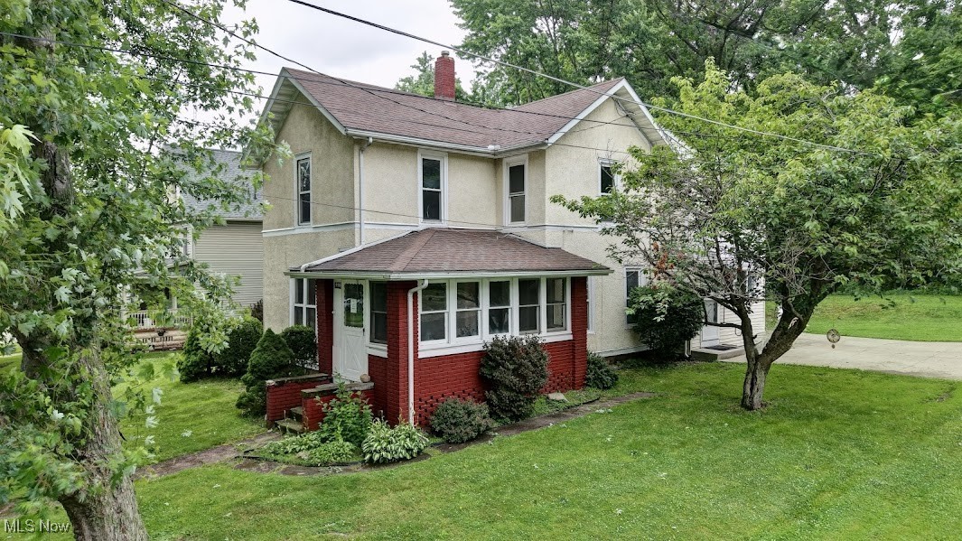 Welcome home to this charming three bedroom, two bath colonial. Gorgeous, large kitchen that is open to the dining area, offering refrigerator, built in microwave, dishwasher, plenty of cabinets, double sink, and new light fixtures. The full bathroom is complete with jetted tub. Living room with built in cabinets, new flooring and freshly painted throughout the entire home. Custom built barn door leading to office or potential 4th bedroom. Upstairs features three large bedrooms, updated bathroom with original claw foot tub, and conveniently located laundry area with walk-in closet. Relax in the spacious sunroom! New plumbing in the basement (2025). AC/Furnace (2021), HWT (2019). One Car attached garage and new driveway (2017), Yard drain (2022). Relaxing backyard where you can sit out and entertain, grill or just relax. Downtown Wadsworth is close. All you have to do is move right in!