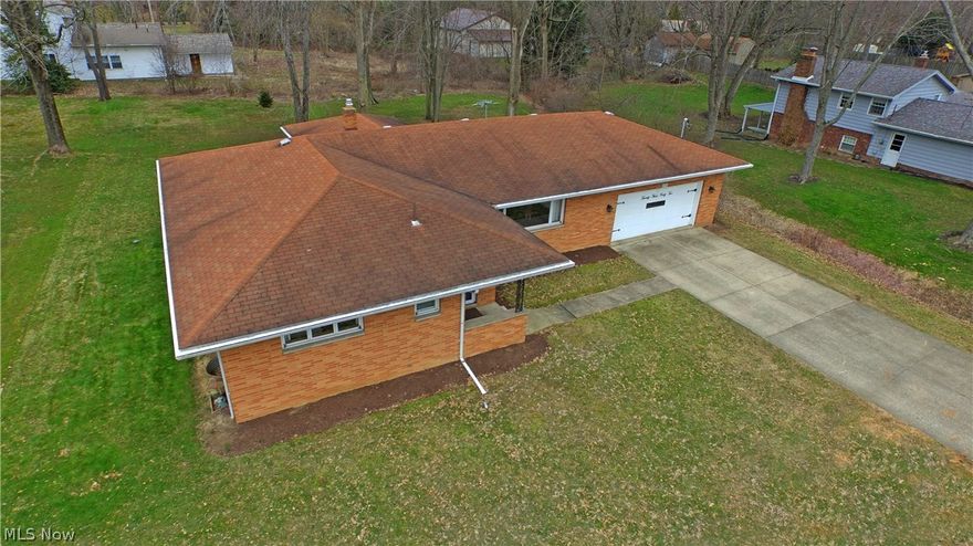 This stunning brick ranch is nestled deep in a low traffic neighborhood, making for a beautiful and quiet place to raise your family. Once you’ve taken in the large yard and concrete driveway, step inside the warm foyer and into a bright and spacious main living room. Rich, hardwood style flooring fills the home as it spills into the dining room before making its way down the hall. The recently remodeled kitchen is gorgeous with high polished stone countertops, and light ash colored flooring. Stark white cabinets fill the room while a stepped ceiling shines recessed lighting down to the floor. An inviting dining area sits nearby with outdoor access through sliding glass doors. Making your way down the hall, a large revamped full bath boasts a handsome double vanity, swept tile flooring and shower. Each of the three bedrooms offer carpeted flooring and cozy living space. The large master bedroom offers an additional full private bath styled in welcoming colors. A full basement provides