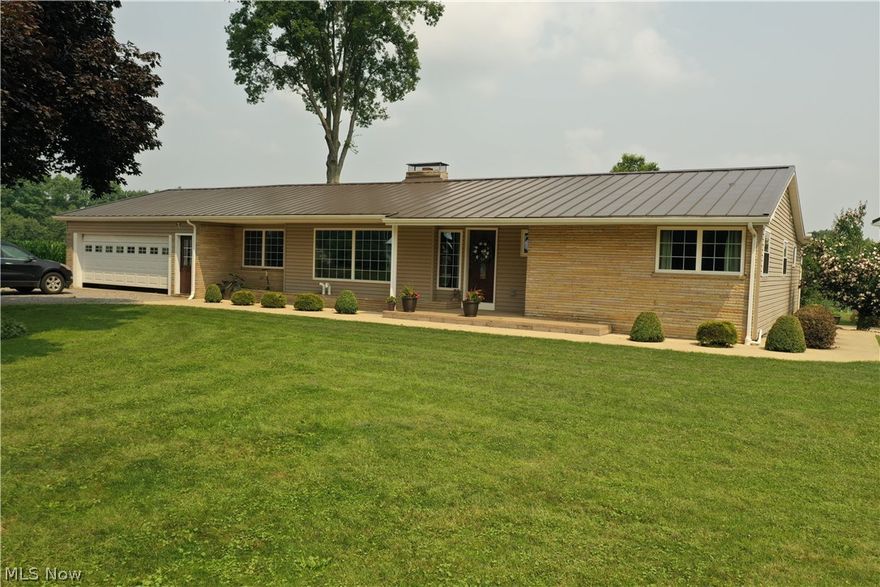 You name it, this home has it! This sprawling ranch home is situated on 1.5 acres and features 4 bedrooms, 2 1/2 baths, formal dining room, living room, family room with vaulted ceilings, gas fireplace and bar, eat in kitchen with an indoor BBQ grill, large laundry room/office, and storage galore! Updates to the home were completed in 2013/2014 and include new windows, new metal roof, siding, furnace, all new doors, new hot water tank, new central AC, 32x44 heated garage with 3 12' x 12' overhead doors and heated floors. The concrete apron is also heated so no snow or ice accumulates in front of the garage. Great care has been taken in selecting low maintenance landscaping around the property. Natural light sets the tone of this home and provides a welcoming atmosphere. The two car garage that is attached to the home enters directly into a large foyer area off of the kitchen. The kitchen features a breakfast bar and stainless steel refrigerator. The large pantry cupboard holds small ap