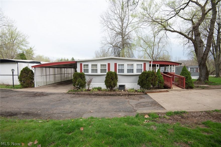 Welcome to this thoughtfully remodeled double-wide home, offering a ranch-style floor plan with 3 bedrooms and a dedicated laundry room. Inside, you’ll find beautiful KraftMaid cabinetry in the kitchen, newer appliances, and an extended eating area perfect for everyday dining. The home features all-new vinyl click-and-lock flooring throughout for a clean, updated look.

Worried about having enough outdoor space? This property sits on approximately 0.25 acres at the end of a quiet dead-end street, giving you the privacy and flexibility you’ve been searching for. Step out onto the full deck and follow the walkway to a one-car garage with an impressive second-story loft boasting 10-ft ceilings—ideal for storage, a workshop, or future creative use.

A private bridge crosses a soothing creek that runs through the property, leading you to a fire-pit area perfect for relaxing or entertaining. The fenced-in section of the yard provides a safe space for pets or children to play worry-free.

Just a short walk away, you’ll also enjoy access to a private lake offering fishing, swimming, and a clubhouse—great for hosting birthday parties, gatherings, or community events.

Whether you're a first-time buyer, starting a family, or looking to downsize and enjoy a peaceful retirement, this property offers a unique blend of comfort, charm, and outdoor enjoyment. Opportunities like this don’t come around often—schedule your showing today and see everything this home has to offer.
