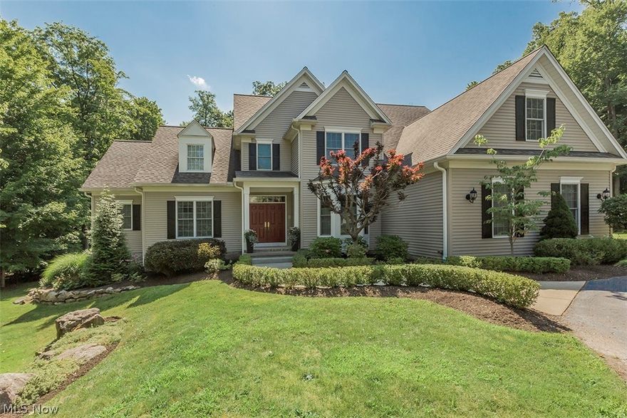 This custom built home is set on a wooded cul-de-sac lot overlooking the nature preserve in desirable Laurel Springs community. Walk in to a foyer that opens to a huge great room with a wall of windows and vaulted ceiling. Hardwood flooring was inatalled in the dining room & great room to provide continuous wood flooring throughout the main level living area. The gourmet kitchen features 200+ year old old barnwood on vaulted ceiling, granite island chandelier with cook top. 1st floor office with french doors is a nice plus.  Spacious Master Bedroom Suite on first with a huge walk-in closet & wonderful Master Bath with frameless glass shower surround, Kohler Whirlpool tub Toto toilet, newer cabinets, counter tops & heated tile floor. Half bath & 1st floor laundry room room with an abundance of storage. Step out to the deck that overlooks the expansive yard. The lower walk-out level features a wet bar, and full bath. Upper level has 3 bedrooms, One bedroom has a bonus room.  Don't miss t