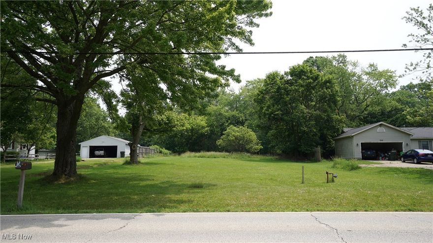 Opportunity awaits with this conveniently located .72-acre parcel just minutes from the iconic Tallmadge Circle, Tallmadge City School Campuses, and the Tallmadge Recreation Center! Located near both shopping and dining; while providing easy access to major highways, this level lot has a substantial wooded area allowing you to set your home back from the road to create a wonderfully private backyard. Public water and sewer are available, along with access to both electric and natural gas; this site is ready for construction. Don't miss this chance to own land and build your dream home in Tallmadge!