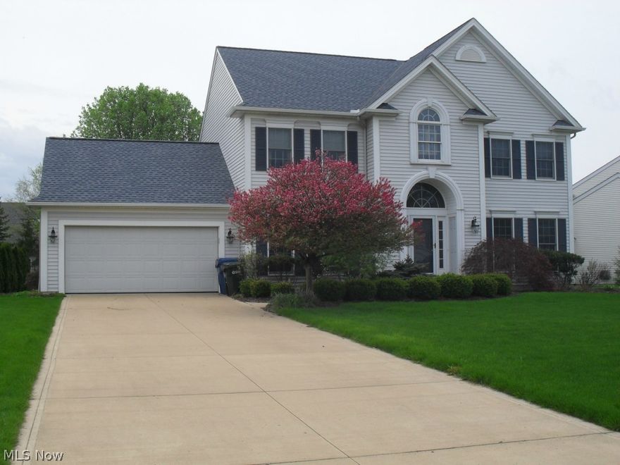 Welcome to the Olmsted Falls colonial! Spacious room sizes! All appliances stay! Large open eat-in kitchen with ceramic tile floors, center island and 2 pantries! Nice size brick patio for outside entertaining. Relax in large family room with gas fireplace! Master bedroom with master bath features a Jacuzzi tub, separate shower and skylight! The full basement is plumbed for a 3rd bath and is ready to finish or use for storage! New roof(2011) and new wood floors(2010) Home warranty is included! Sprinkler system! Crown molding in dining room, family room and living room! 9'ceilings! All bedrooms have ceiling fans! 2 story foyer with ceramic flooring! Great place to call home!