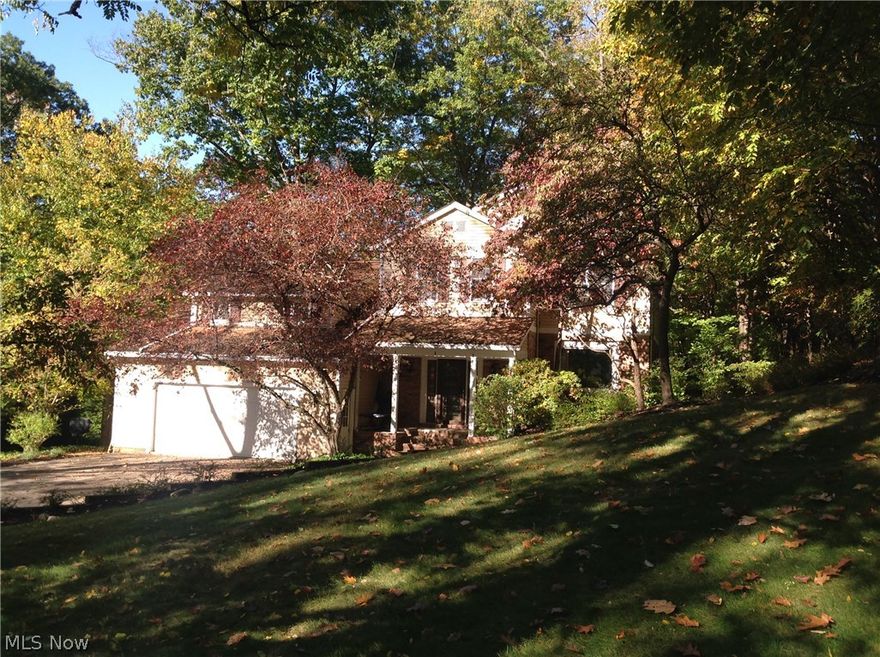 Location, Location, Location…Wonderful family neighborhood and safe walk to downtown Chagrin Falls  Priced to sell!  Great opportunity to scoop up a fabulous Chagrin Falls home at below market value.    This spacious 4 bedroom home has great bones and no major concerns, needs just a bit of updating.  Here is your chance to grab a bargain and then make it your own.  First floor has a dramatic entry, a paneled library/office, spacious formal dining room and living room.  Family room has fireplace and access to back deck.  Kitchen needs updating but offers plenty of space.  Newly remodeled finished lower level.  New carpet in family room and basement (2015),  new roof (2005),  AC (2011).