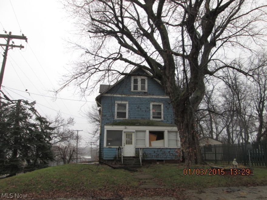 Large 3 bedroom home on large corner lot.  Enclosed front porch, foyer, large living room & dining room plus utility room.