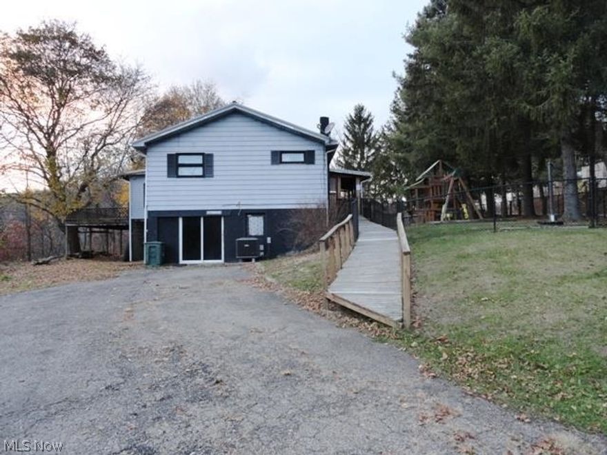 3-4 BR country home w/wrap around deck on 10.97 acre lot-mostly wooded.  Eat in country kitchen, LR w/wall of built in bookcase.  Full basement.  Above ground pool, fenced yard.  New Manchester school district. Very Motivated Seller