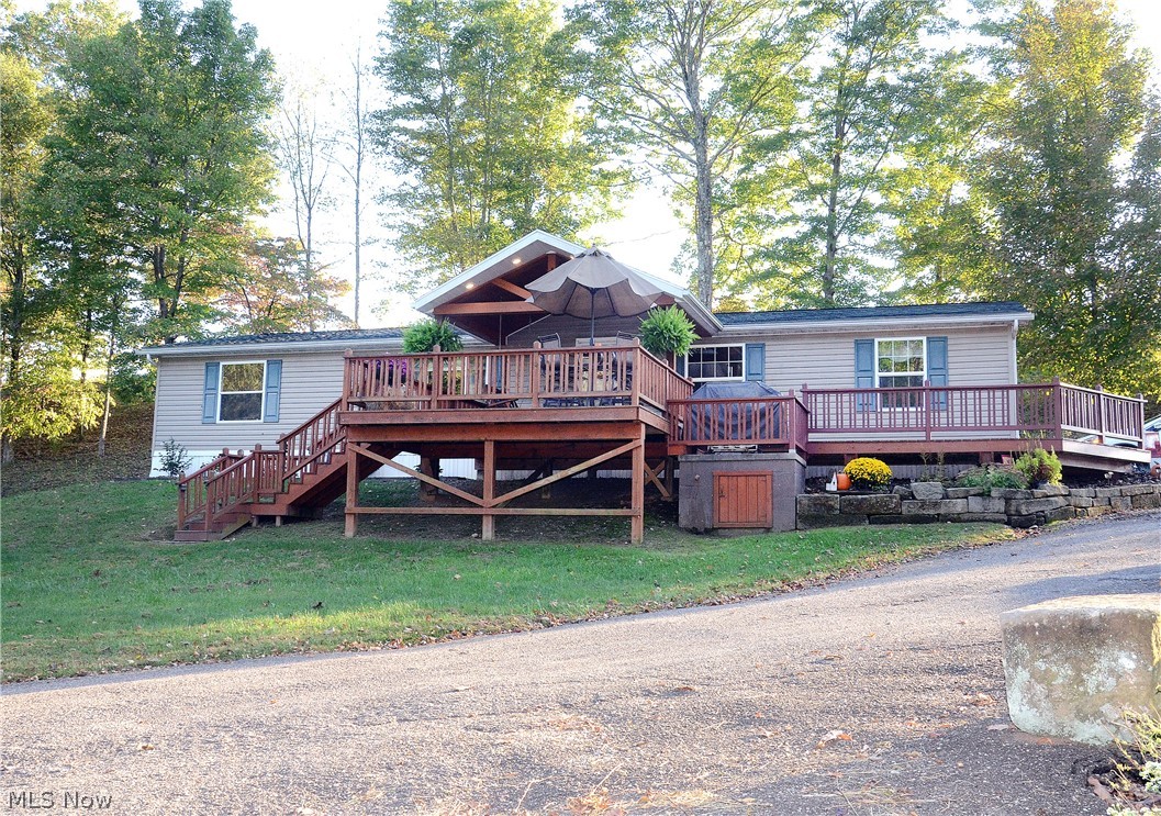 Park like setting for this 16 acre m/l wooded property. 1999 Skyline (surrendered to real estate). 3 Bedrooms, 2 baths. Living room plus family room, beautiful oak kitchen. Large covered deck, detached garage 22' x 22", rustic barn, horse barn. Gorgeous picnic area w/fire pit. Property could be divided Minerals reserved but could be negotiable. Oil & gas lease expired.