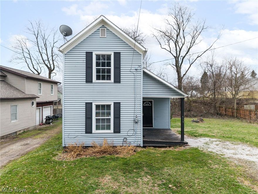 Why rent when you can own?! This charming colonial in Barberton is truly move-in ready and offers a comfortable, functional layout.  Step inside to discover tall ceilings, fresh paint, and newer carpet throughout. The open floor plan flows effortlessly from the spacious living room into a large eat-in kitchen featuring beautiful maple hardwood flooring—perfect for everyday living and entertaining. Ceiling-height cabinets provide plenty of storage space for dining and pantry needs. Upstairs, you’ll find a comfortable master bedroom, a full bathroom, and a versatile loft area that can easily serve as a second bedroom, office, or or flex space depending on your needs. Neutral décor throughout the home makes it easy to move right in and add your personal style. Did I mention that all kitchen appliances and washer & dryer will remain?! Located just 1 mile from shopping and local restaurants. This well-maintained home offers great value and a convenient opportunity for homeownership. Don't miss out!