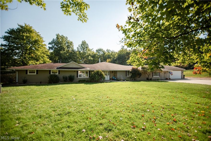 SPRAWLING RANCH situated on beautiful 2.35 acre lot! This updated home gives plenty of room to roam! The flexible floor plan offers two living spaces and it's  ideal for those who work from home and need privacy. The south wing can easily be converted into an additional living suite with full kitchen, PLUS, there's an enormous partially finished workshop/ storage space with skylights that could also be finished into additional living space. The spacious Great Room is in the center of the home. This impressive room offers a full wet bar and wood burning stove. The adjacent master suite has an updated bathroom with travertine flooring, jetted tub and custom shower. Sliding doors open to the backyard patio/ courtyard and deck, and heated above ground pool! The updated kitchen offers maple cabinetry, newer appliances, and custom, eat-in island. The adjacent dining room will accommodate large gatherings. There are many recent improvements! Enjoy a country setting with easy access to I-77 and minutes from all the shops at Summit Mall and Montrose. Top rated Revere school district! Don't miss!!