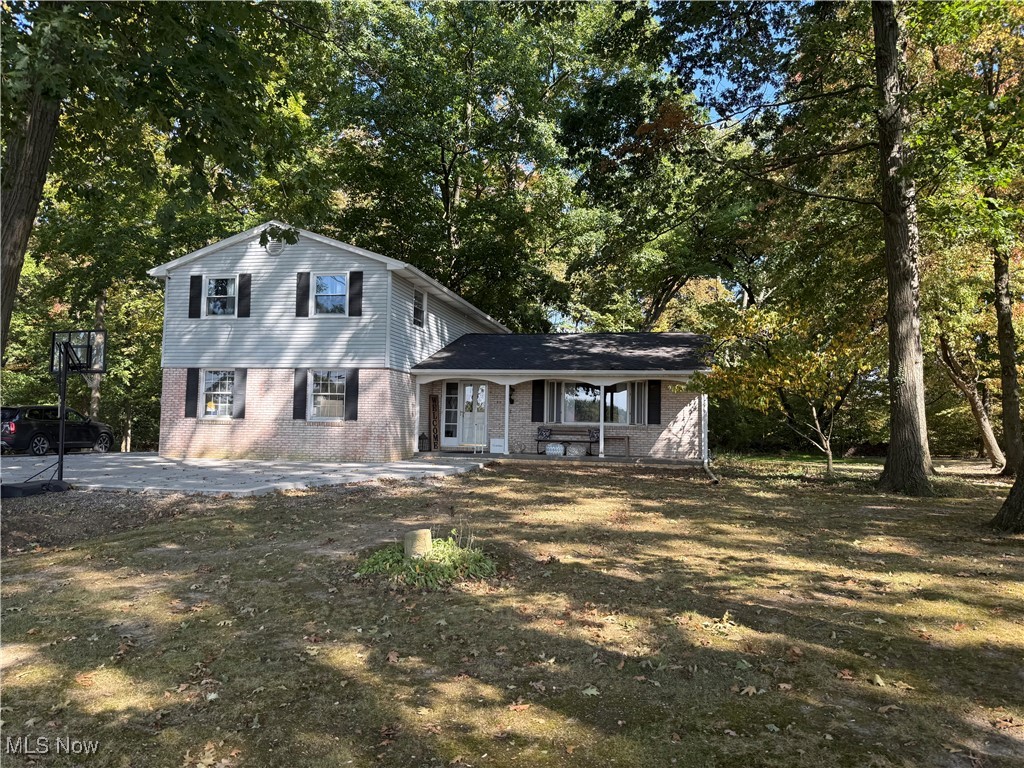 Escape the noise and discover your private sanctuary in this brick home nestled in the woods. Set on a secluded 1.4 acre lot, this property offer the perfect blend of charm and everyday comfort.
Inside, you'll find plenty of space to spread out and enjoy the benefits of an open floor layout. The front door welcomes you to a functional entryway leading to a spacious living area that opens into the dining room. The modern eat-in kitchen features butcher block counter tops, open shelving, stainless appliances and overlooks the cozy family room. The wood burning fireplace and wood beams make the living area feel like a peaceful retreat. Family room also leads to a first floor 1/2 bath and outdoor living area. Upstairs you will find a very spacious master bedroom with double closets, an updated full bath, and 2 additional bedrooms. And, it doesn't stop here........the outside space has breathtaking views, privacy, and room to run. This home can be yours to enjoy the abundance of fall beauty