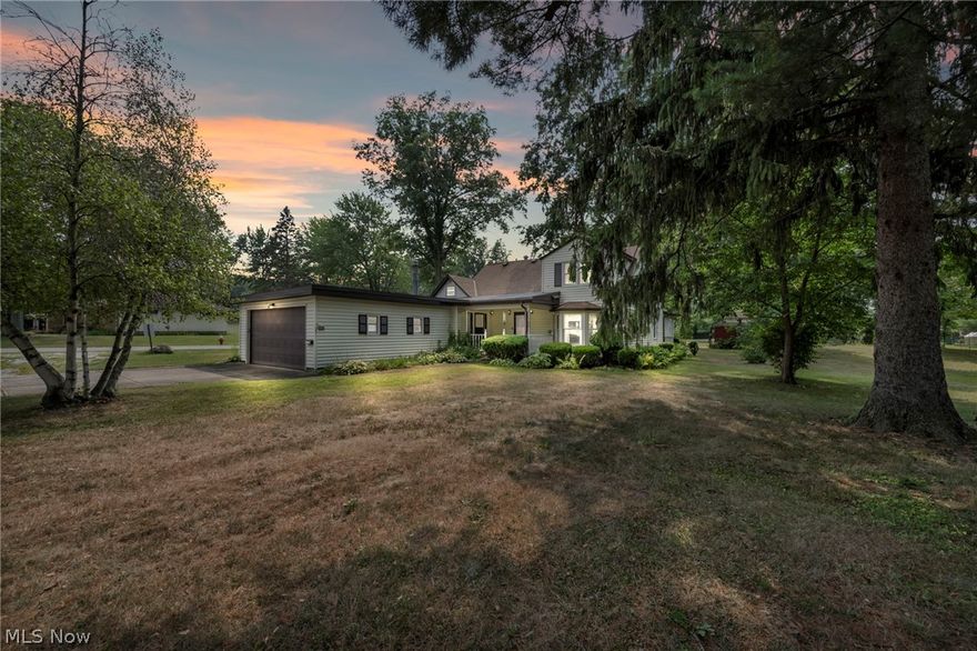 Charming Farmhouse on a Larger Country Style Lot in Desirable North Ridgeville with a much sought after Outbuilding. Delightful farmhouse nestled on an expansive lot comprising 8 parcels, offering potential for an additional buildable lot. With frontage on two streets, this property combines rural charm with urban convenience. Home features 4 bedrooms & 2 full baths, including a convenient first-floor full bath & laundry rm. Attached garage is complemented by a highly sought-after outbuilding (w/expansive garden area) perfect for storage or hobbies. Relax & entertain on the magnificent oversized covered deck, or enjoy the serene country setting from the inviting front porch. Situated near highways, shopping, and entertainment, this home offers the best of both worlds. Exterior has been updated w/low-maintenance vinyl siding, dimensional shingles, fresh exterior doors, & many new vinyl windows, enhancing its attractiveness & energy efficiency. Inside, home is light-filled & comfortable throughout. Eat-in kitchen is ideal for casual meals, while the formal dining rm is perfect for larger gatherings. Living rm features a bay window, & the oversized family rm boasts Nature Stone flooring, full bath, & large laundry rm w/workspace. Much sought-after outbuilding provides endless possibilities, whether you need extra storage, a workshop, or a studio. This exceptional property offers a beautiful country setting within the city, all at an affordable price. Don't miss the opportunity to make this charming farmhouse your own, w/the added potential of a buildable lot for future expansion. Discover all that this unique property has to offer w/immediate occupancy available.