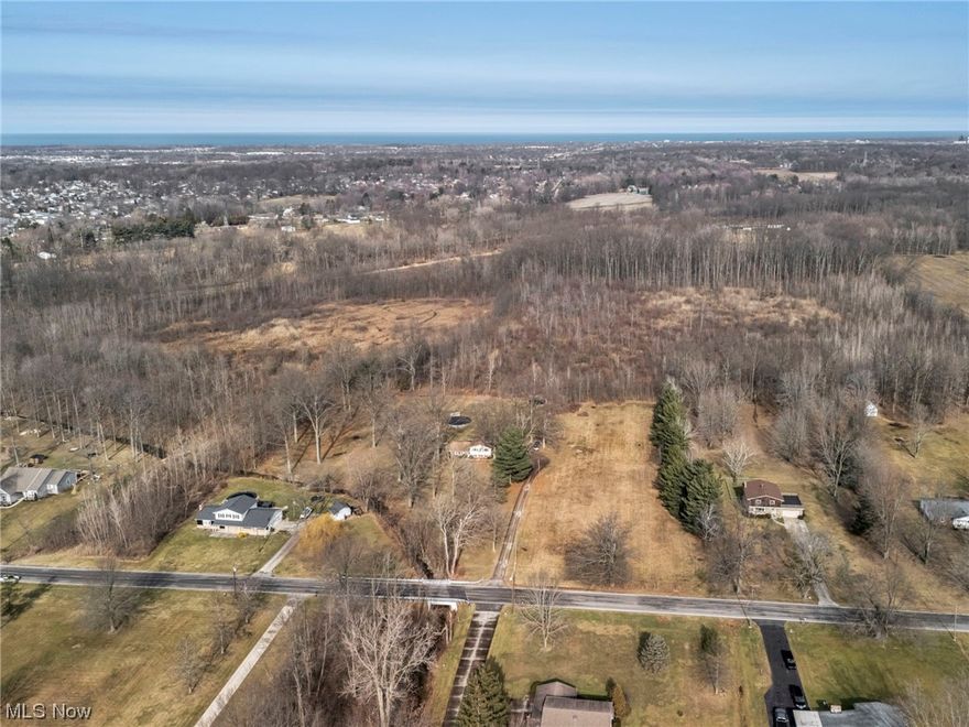 One of a kind opportunity to BUILD YOUR ESTATE HOME on one magnificent 31.39 Acre treed private lot (125ft of frontage that opens up to a massive lot...Could be developed) with quality/desirable Amherst Schools (Located in the township...No Rite for income tax $$$ savings). Honestly an opportunity to own a piece of land such as this at an affordable price does not come along often. Build your home home or use one of our builders...No requirement on who builds & no HOA requirements/rules. Imagine a long winding drive to your private home situated in the trees or clearing whichever you prefer. We believe utilities are at the street, buyers are responsible for due diligence. Perfect as one private estate lot (may support more than one home as a private family compound) or could also be developed into a small neighborhood. Call today for details & private showing
