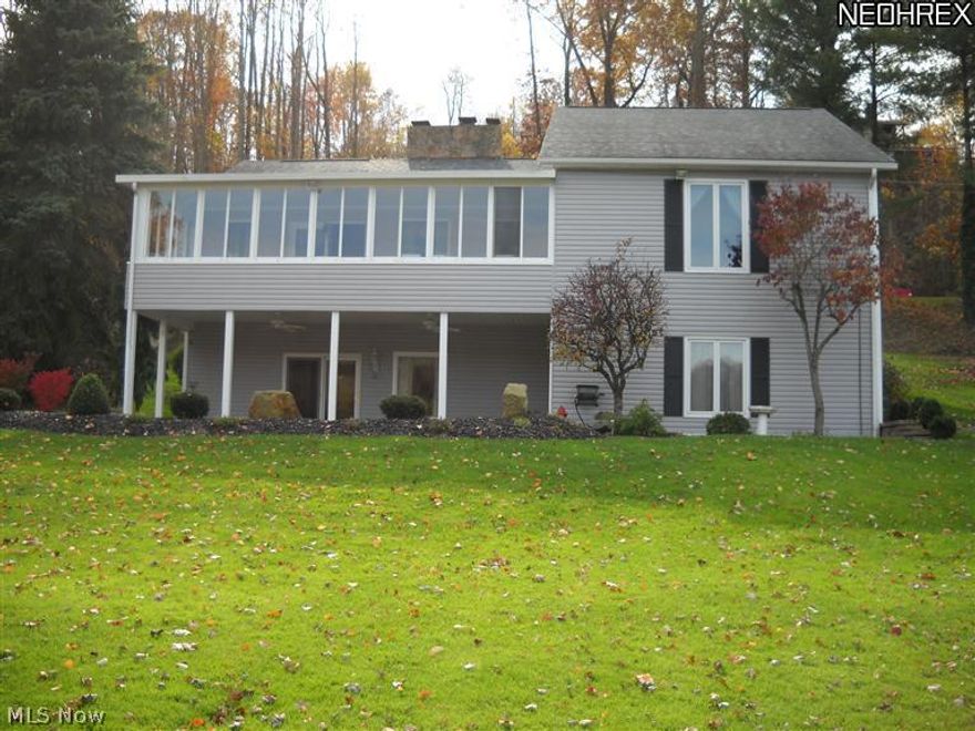 Don't wait another minute to explore this beautiful water front property. Main floor has open kitchen, living room with fireplace and skylights leading to an enclosed sun porch looking out over the water. The master bedroom has master bath, double vanity, soaking tub and shower with two walk in closets. A second bedroom and full bath also on main level. The finished lower level is perfect for entertaining with third bedroom, full bath and remodeled kitchen having granite countertops. Family room with fireplace which walks out to covered rear porch and brick patio with fire pit and level lot to dock. Vinyl siding, new shingle roof and brick patio nre during past 10 years. Three car attached garage. Nice quiet bay just past the main beach. Dock stays with home. Lot #316.