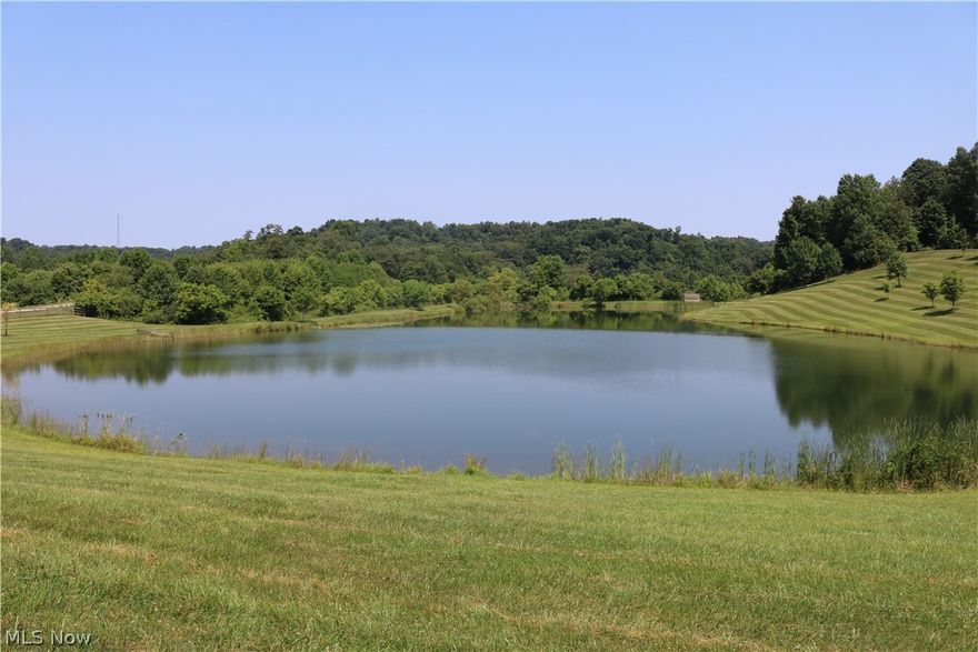 An amazing find close to Cambridge that will make you go wow! The lake on this property is immaculate as well as the well manicured lawn and trails leading up to the top of the ridge where a flat open field could be a hay field or food plot or maybe a spot to put that perfect hunting cabin. This property would be great for Air BB cabins or even just camper hookups by the lake. Hunting is terrific and the timber on here could be selectively harvested. A small storage barn goes with the property. No minerals. 14 acres across the road could be opened up for possible income from an old bill board. This is a stand alone  parcel that could be sold separately. Gated entrance, a very nice property all the way through..