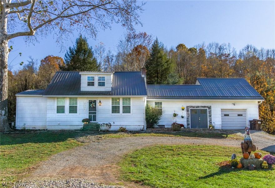 This gorgeous property has SO much to offer!! A recently gutted and fully renovated primary residence with 2 bedrooms and two full baths, PLUS an income producing rental single-wide, three nice barns, and over 32 acres of pristine land ready for farming and/or hunting! One of the barns measures 64 X 50 and was just built in 2021.  The home is simply gorgeous with rustic touches and a true farmhouse feel. The gorgeous living room greets you upon entering with gas fireplace and an open concept feel to dining room and kitchen. Modern bright, white kitchen with new appliances, concrete countertops and soft-close cabinets are sure to be a cook's dream.  Exposed beams throughout the home add to the rustic charm. Manifold plumbing, new roof, and the interior is all updated!  Master bedroom offers ample closet space, a walk out to back deck and a stunning master bath with tiled shower and large soaking tub. Loft bedroom includes an office nook and ample closet space. The trailer offers 2 bedro