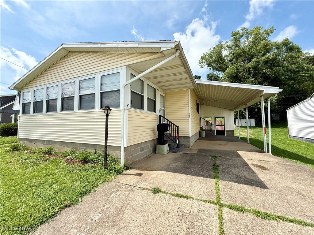 This beautifully maintained 2 bedroom, 1.5 bath home is sure to steal your heart as soon as you step inside! The front door brings you right into the stunning sun room - prefect as a 4 seasons retreat to enjoy your morning coffee or unwind with good book year-round! The kitchen has been tastefully updated featuring modern appliances and gorgeous cabinets, which is open to the attached dinning area. The door in the kitchen lead to the carport parking area., allowing for convenient access The mudroom leads out to the back deck that has been freshly refinished. This charming home is conveniently located and move-in ready! Don't miss out on this beauty!