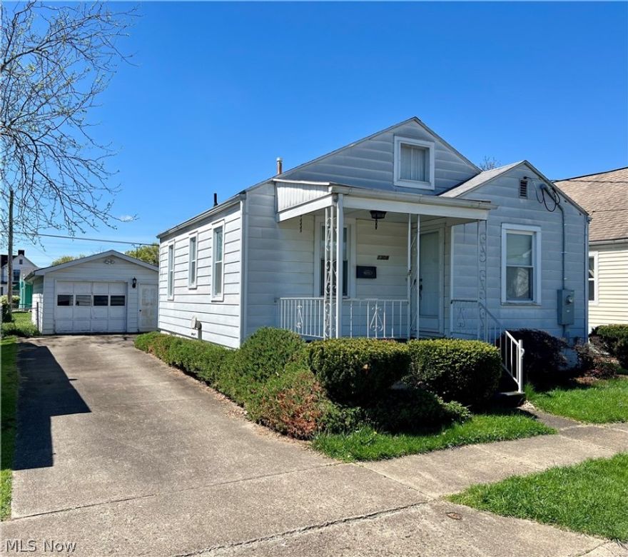 Cute as a button, bungalow: 2 bed 1 1/2bath with a detached garage & full basement. The garage has an office built in back with 1/2 bath.  The home features a full partially finished basement, updated electric and HVAC.  Sold as is. Stove in basement does not work.  Move in ready.