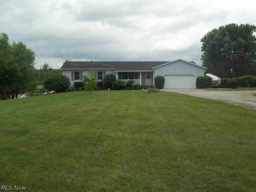 Enjoy this ranch style home sitting on 3 acres! This home offers 3 bedrooms & 2 full baths!  New aerator & new linoleum in 1st floor Laundry room June 2014. Back deck added on 2010. Both front & back deck were freshly stained June 2014.  Water tank replaced in Nov 2013. Well replaced in 2007.  Garage is over-sized.  Full walkout basement that is just waiting for your personal touches!   Call for your personal showing today!