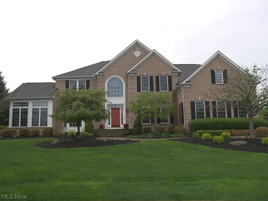 Gorgeous brick front transitional on a spectacular lot backing up to the golf course overlooking the 4th fairway.  Professionally designed and landscaped with a Koi pond, brick patios, pergola, putting green and great views.  As you enter the two story foyer, there is the living room which opens to the library and a formal dining room.  Views from the foyer of the two story great room with a stone fireplace and a wall of windows and the awesome kitchen with an abundance of cabinets, stainless appliances, a center island, plenty of space for an eating area, but also has a morning room off the kitchen with doors to the outside. There is a “T” staircase leading to the second floor with the guest suite on one side of the staircase and the other two bedrooms each with bath access and the grand master suite with walk in closet and glamour bath with double vanities.  Not to be missed is the fabulous lower level which includes a theater room, recreation room, kitchen, bath and much more.  This