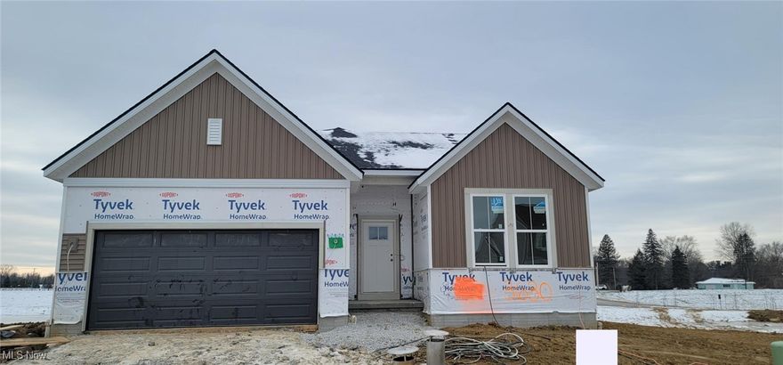 Available January 2026! First Kenai home with pond views in Spring Hill Villas, Green. This stylish 3 bed/2 bath ranch by Drees Homes delivers one-level living with excellent curb appeal: decorative gable peaks, mixed siding with stone veneer base, vertical board & batten accents, and contrasting trim that make the façade pop.
Inside, enjoy an open-concept kitchen/family room/dining layout. The kitchen features an oversized island, burlap base cabinets with white 42? uppers trimmed in crown, a walk-in pantry with wood shelving, granite counters, custom tile backsplash, and Whirlpool stainless appliances (including a gas range). Relax in the family room anchored by a stone feature wall and interior gas fireplace.
The primary suite is tucked at the rear for privacy and has pond views. The en-suite includes a ceramic tile super shower with frameless glass, quartz counters, matte black Moen fixtures, and arched mirrors. Bedrooms 2 & 3 are located together in a separate wing with a shared full bath.
Key upgrades: luxury vinyl plank flooring, soft carpeting in bedrooms, craftsman style trim, linear pendant and recessed LED lighting. Practical features include a family foyer drop zone off the garage, adjacent laundry room, and an 1,800 sq ft unfinished basement with ¾ bath rough-in and egress window – ideal for future expansion.
Enjoy the extended Outdoor Living space with gas fireplace and stunning views of the pond. 
Convenient location just minutes from I-77, Rt. 619, Green Schools, Portage Lakes, shopping & dining.