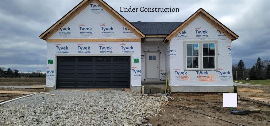 Available January 2026! First Kenai home with pond views in Spring Hill Villas, Green. This stylish 3 bed/2 bath ranch by Drees Homes delivers one-level living with excellent curb appeal: decorative gable peaks, mixed siding with stone veneer base, vertical board & batten accents, and contrasting trim that make the façade pop.
Inside, enjoy an open-concept kitchen/family room/dining layout. The kitchen features an oversized island, burlap base cabinets with white 42? uppers trimmed in crown, a walk-in pantry with wood shelving, granite counters, custom tile backsplash, and Whirlpool stainless appliances (including a gas range). Relax in the family room anchored by a stone feature wall and interior gas fireplace.
The primary suite is tucked at the rear for privacy and has pond views. The en-suite includes a ceramic tile super shower with frameless glass, quartz counters, matte black Moen fixtures, and arched mirrors. Bedrooms 2 & 3 are located together in a separate wing with a shared full bath.
Key upgrades: luxury vinyl plank flooring, soft carpeting in bedrooms, craftsman style trim, linear pendant and recessed LED lighting. Practical features include a family foyer drop zone off the garage, adjacent laundry room, and an 1,800 sq ft unfinished basement with ¾ bath rough-in and egress window – ideal for future expansion.
Enjoy the extended Outdoor Living space with gas fireplace and stunning views of the pond. 
Convenient location just minutes from I-77, Rt. 619, Green Schools, Portage Lakes, shopping & dining.