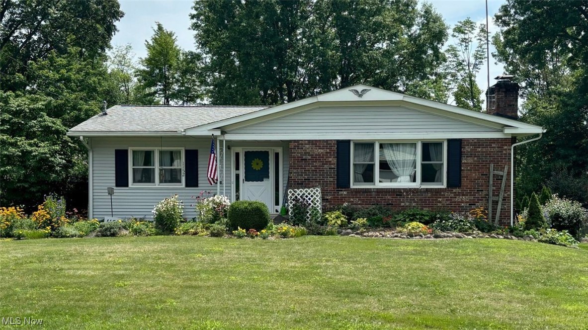 Do Not Miss This Well Maintained Home Surrounded by Gardens!!! With 1,808 sq ft of finished main floor living space and an additional 700 sq ft of finished living space in the lower level, this spacious 4 bedroom 2.5 bath ranch can look deceiving! The fully applianced kitchen sits in the heart of the home and can be easily accessed from all gathering areas. The formal living room has a wood burning fireplace and connects seamlessly to a dining room. The back hallway leads to three generously sized bedrooms, a full bath, AND a primary bedroom with an attached ensuite. The main level also offers an expansive family room which connects to an enclosed sunroom followed by a large deck. Downstairs in the lower level, you will find a rec room with a wood burning fireplace, a bar area, a half bath, and a laundry room. Outside, the driveway provides extra space for parking and leads to the rear entry 2 car garage which is accessible from the lower level. Inside of the garage, you will find a doorway leading into the large workshop/storage room and a root cellar. Updates include: Furnace (2022), Roof (2019), Vinyl Siding (2019), Gutter Guards (2019), Deck (built 2018 and re-stained 2023), Brand New Garbage Disposal (July 2024.) One year home warranty being offered! Call TODAY for your private showing!