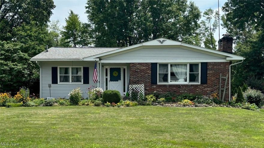 Do Not Miss This Well Maintained Home Surrounded by Gardens!!!  With 1,808 sq ft of finished main floor living space and an additional 700 sq ft of finished living space in the lower level, this spacious 4 bedroom 2.5 bath ranch can look deceiving! The fully applianced kitchen sits in the heart of the home and can be easily accessed from all gathering areas. The formal living room has a wood burning fireplace and connects seamlessly to a dining room.  The back hallway leads to three generously sized bedrooms, a full bath, AND a primary bedroom with an attached ensuite. The main level also offers an expansive family room which connects to an enclosed sunroom followed by a large deck. Downstairs in the lower level, you will find a rec room with a wood burning fireplace, a bar area, a half bath, and a laundry room.  Outside, the driveway provides extra space for parking and leads to the rear entry 2 car garage which is accessible from the lower level. Inside of the garage, you will find a doorway leading into the large workshop/storage room and a root cellar.  Updates include: Furnace (2022), Roof (2019), Vinyl Siding (2019), Gutter Guards  (2019), Deck (built 2018  and re-stained 2023), Brand New Garbage Disposal (July 2024.) One year home warranty being offered!  Call TODAY for your private showing!