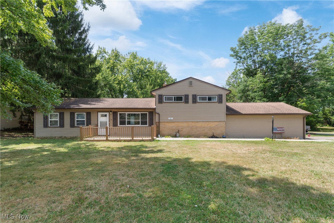 Welcome to 3931 Rosalind Drive in Rootstown! Step inside to a bright and spacious living room that flows seamlessly into the eat-in kitchen, complete with granite countertops, stainless steel appliances, and ample cabinet space. The first floor also offers a versatile flex room, a comfortable bedroom, and a full bathroom. Upstairs, you'll find another full bathroom and two additional bedrooms, one featuring a large walk-in closet for all of your storage needs. Outside, enjoy nearly an acre of yard with a brand-new deck (2023), perfect for entertaining, gardening, or simply relaxing in your private outdoor space. Notable updates include: new appliances (2018), furnace (2021), deck (2023), hot water tank (2024), attic insulation (2024), and crawl space waterproofing (2024). Conveniently located close to local schools, this move-in-ready home combines comfort, style, and peace of mind! Schedule your showing today!