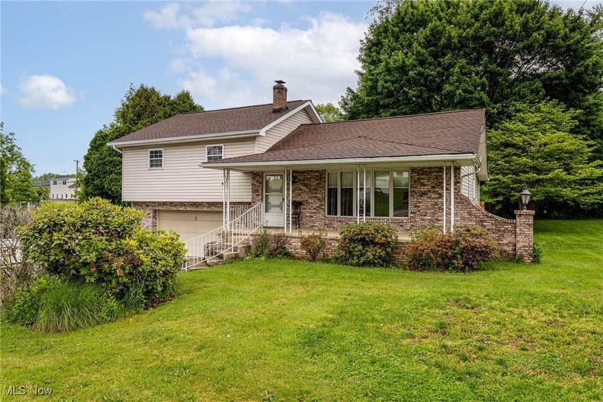 Beautiful and solid split level with brick and newer vinyl siding: Elegant brick walkway up to the large concrete front porch, open living room upon entry, convenient half bath with new flooring and toilet, eat-in kitchen breakfast bar/island with barstools walk-in closet/pantry, and step-down rear family room with bookshelf, stone accent wall, and large windows. Second floor features 3 large bedrooms with original hardwood flooring, and huge full bath with new vinyl flooring. Basement has laundry room with washer and dryer. Back door leads to elevated deck, and separate door goes to ground level covered patio. 2.5 car garage features ductwork available for independent heating, and 220 electrical. Huge storage shed in rear, and very private (.4+ acres) yard/partially fenced with healthy mature trees, arborvitae, and perennials. Solid oak build throughout, newer a/c, furnace, hot water tank (2020), windows, all flooring, paint, hardwood refinished (2021-2025) roof is 7 years old. Schedule today!