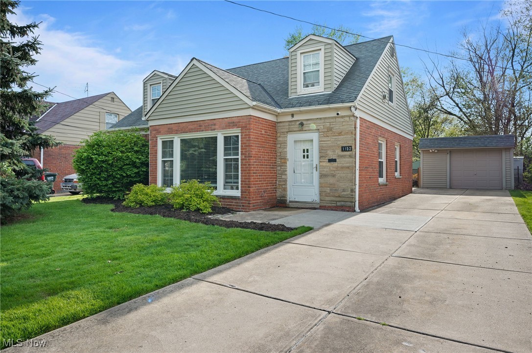 Welcome to 1152 Washington Blvd – A Beautiful Brick Cape Cod with Charm, Space, and Style in Mayfield Heights! This delightful 3-bedroom, 1-bath home is full of personality and warmth, offering over 1,000 square feet of thoughtfully designed living space that feels both cozy and spacious. From the moment you arrive, you’ll fall in love with the classic brick exterior and inviting curb appeal.
Step inside to a fresh, modern palette of light gray and white, setting the stage for easy, stylish living. The large, sun-drenched living room welcomes you with beautiful picture windows and a charming fireplace—perfect for relaxing or entertaining. The open layout flows effortlessly into the cozy dining area and updated kitchen, where you'll find plenty of counter space for prepping meals, hosting friends, or trying out your next recipe. Need functionality? The laundry area is smartly located with direct access to the backyard—perfect for busy mornings or muddy boots after backyard fun. The main floor features two generously sized bedrooms and a full bath with modern touches. Upstairs, the spacious third bedroom offers privacy, tons of natural light, and all the character you’d expect in a classic Cape—ideal for a peaceful retreat, home office, or creative studio. Enjoy your own backyard oasis with a covered patio that’s perfect for summer cookouts or cozy fall nights. The fully fenced yard offers space to play, garden, or simply unwind. Whether you’re starting out, downsizing, or somewhere in between, this home checks all the boxes for comfort, charm, and convenience—just minutes from shopping, dining, parks, and freeway access. Don’t miss your chance to make this Mayfield Heights gem your own!