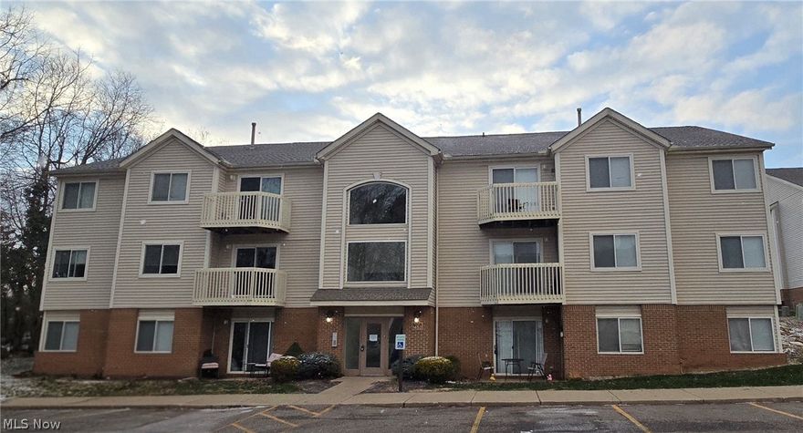 Completely remodeled in 2022, this four-bedroom, single-level condo is located in Brookledge Commons in Cuyahoga Falls, just minutes from Chapel Hill. The open living and dining area features a full wall of built-in cabinets and shelving, plus a wine fridge. Updated flooring runs throughout the unit. The kitchen offers granite countertops, stainless steel KitchenAid appliances, a modern tile backsplash, and bar seating that opens to the main living space. The primary bedroom includes a walk-in closet and a private ensuite with a tiled walk-in shower. A second full bathroom features a freestanding soaking tub. Sliding glass doors lead to your own private brick patio overlooking a wooded area. The unit has a lower-level entrance with the living space all on one level. In-unit washer and dryer included. Additional features include efficient gas and electric utilities, a reserved parking space, and access to community amenities including a pool and fitness area.