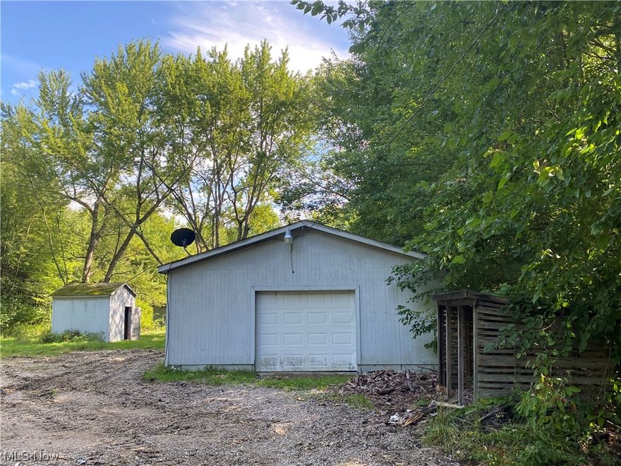 Here is almost an acre of pure country situated within a nice clearing & surrounded by woods for privacy & only 5 miles to Jefferson! There is a garage, a shed, a small outbuilding, & enough room for a big garden & maybe even some chickens! Buyer to do due diligence on ability to build as well as building/zoning requirements. Lenox township zoning rules, regulations, & contacts/directory are included in the disclosures in their entirety.  Article 3 discusses non conforming lots & structures of record. Variance may be required due to lot size & width.