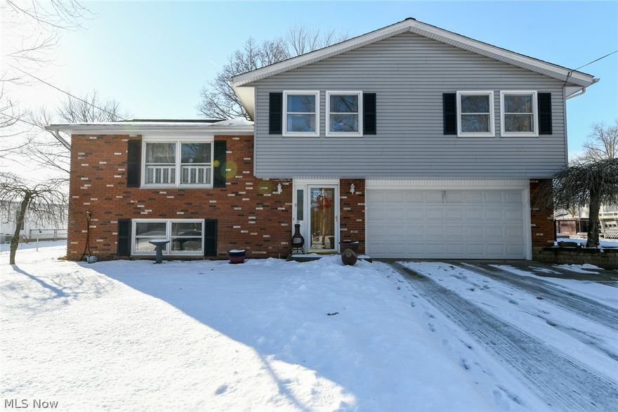 Beautiful house in Tallmadge neighborhood!  Welcoming foyer with space for personal decorations, double closet, adorable half bath. Walk up the split staircase to a bright, spacious living room continuing into the remodeled kitchen and dining area.  The wall was removed showing off the gorgeous custom-made cabinets with soft close hinges, quartz countertops, stainless farmhouse sink, hands-free faucet, high-end appliances, and an island!  Every fixture, finish, and detail has been perfected!  New sliding door draws you into the amazing sunroom built in 2019 and the warranty transfers!  Enjoy this space with comfortable furniture, television, and your private backyard.  Living room leads upstairs displaying a sliding barn door, four nice-sized bedrooms with gorgeous new carpet, and an incredible full bathroom updated with tub surround, toilet, vanity, vinyl, and large linen closet in hallway.  The master bedroom features double closets with new doors.  The lower level begs for casual re