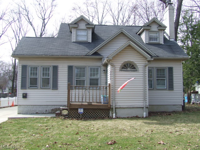 NOT A COOKIE CUTTER HOME! So much larger than it looks! Very spacious 5 bedroom Cape. Situated on one of Stow's prettiest streets, this home is full of character and charm. Living room features WB fireplace, crown molding and hardwood floors with french doors leading to a quaint reading nook. Formal dining room is open to the living room and is perfect for hosting holiday parties! Kitchen has a "farmhouse feel" with updates that include counter tops, backsplash and hardwood floors. Large first floor master bedroom plus another bedroom and full bath on first floor add to the appeal of this home. Upstairs you'll find three more bedrooms and a full bath. Three season sun room leads to a patio and nice fenced backyard with mature trees. Two car garage. Other updates include 22 newer windows on first floor, carpeting, glass block, concrete driveway, and garage roof. Home warranty provided for piece of mind. A little TLC could make this your unique Dream Home!!