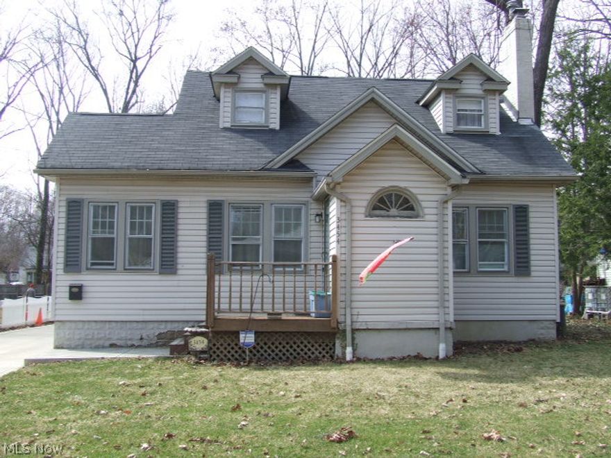 NOT A COOKIE CUTTER HOME!  So much larger than it looks!  Very spacious 5 bedroom Cape.  Situated on one of Stow's prettiest streets, this home is full of character and charm.  Living room features WB fireplace, crown molding and hardwood floors with french doors leading to a quaint reading nook.  Formal dining room is open to the living room and is perfect for hosting holiday parties!  Kitchen has a "farmhouse feel" with updates that include counter tops, backsplash and hardwood floors.  Large first floor master bedroom plus another bedroom and full bath on first floor add to the appeal of this home.  Upstairs you'll find three more bedrooms and a full bath.  Three season sun room leads to a patio and nice fenced backyard with mature trees.  Two car garage.  Other updates include 22 newer windows on first floor, carpeting, glass block, concrete driveway, and garage roof.  Home warranty provided for piece of mind.  A little TLC could make this your unique Dream Home!!
