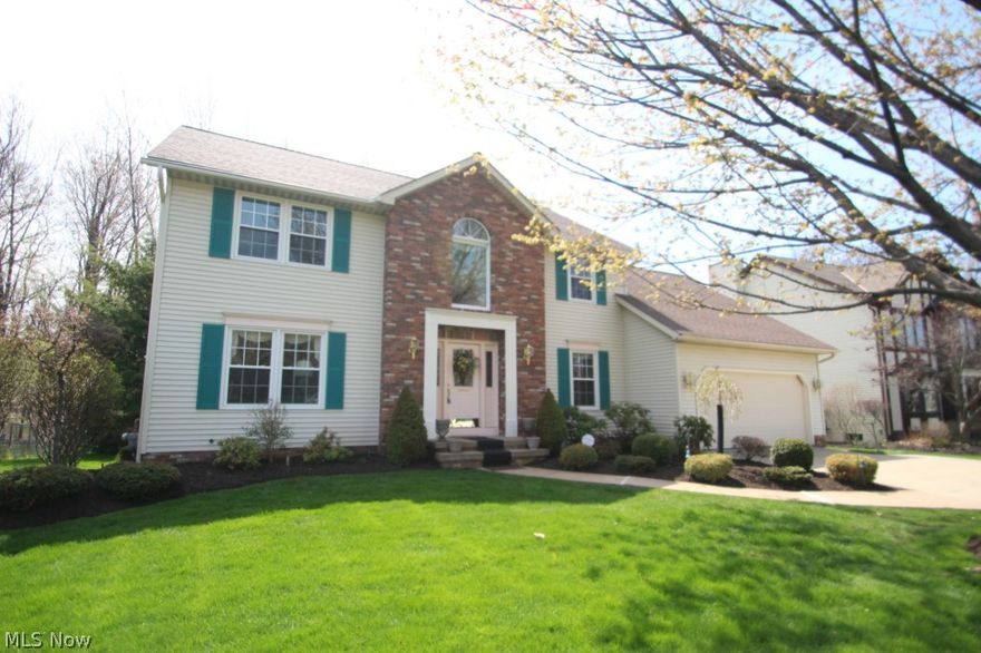 Nicely appointed and very well maintained updated colonial style home in Bellflower Meadows off N Palmerston.  This home is sitting on a beautiful lot with a paver patio, built-in waterfall/fountain, basketball court and composite deck with pergola. A large open foyer entry leads to the formal dining room with custom ceiling and the kitchen with a large dining area, center-island and granite counters. The family room features built-in bookcases, crown molding and a gas fireplace. An inviting 4 season sun room with vaulted ceiling and skylights completes this home. The main bedroom has a walk-in closet, a glamour bath with double vanity, shower, Jacuzzi and sky-lites. Convenient 1st floor laundry and basement with carpeted recreation room as well as additional storage. The living room could be an office/den. Additional features include a 14x9 work room attached to the garage, pull down storage, newer roof, windows, leaf-guard gutters and HW tank. 1 year limited warranty.