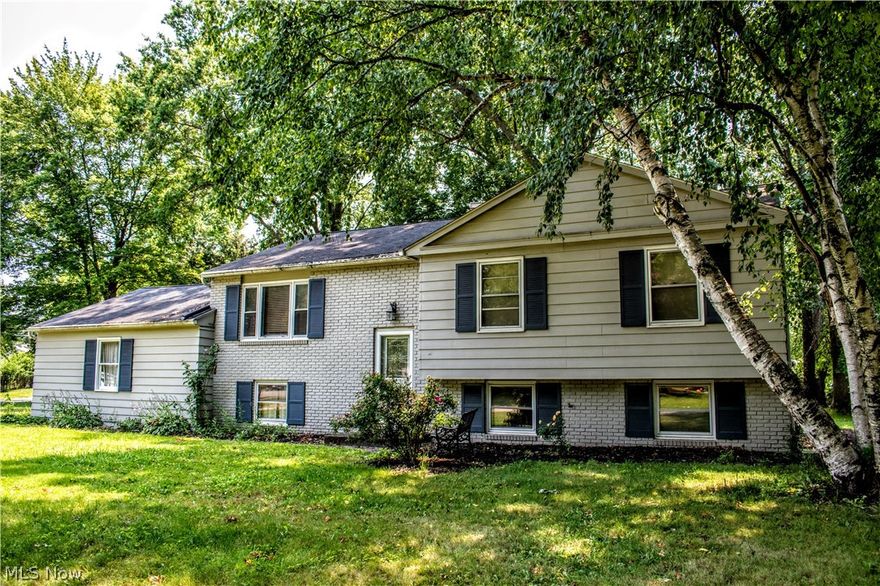 Nice bi-level home on a big beautiful corner lot waiting for you to make it your own. Hardwood floors throughout. Master bedroom has 2 large double door closets and a full bath. Glass sliding doors on upper level lead out to the large deck, great for entertaining or just relax and enjoy the wooded lot. With some TLC and your personal finishing touches, this could be your perfect home!