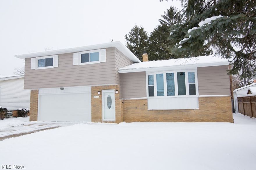 Move Right In!  This stunning renovation has been painstakingly completed with every detail in mind.  Refinished hardwood floors on the main living level, custom kitchen remodel with gleaming granite counters, stainless steel appliances, custom cabinetry, undermount lighting and gorgeous ceramic flooring. . Four large bedrooms on the second level featuring abundant closet space. All baths completely remodeled with all new fixtures, lighting, tile and flooring. Large yard for summer entertaining. Additional updates include glass block windows in the family room, all new exterior doors, new garage door and opener, new furnace, new hot water tank, 3 dimensional roof (tear off), all new windows, new electrical panel box and updated wiring.  This home won't last long!  Call today to schedule your personal tour!