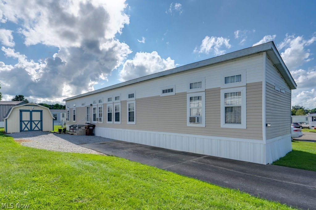 This home is impeccably maintained, has so many unique touches, and is move-in ready. Large extended driveway (2021), huge storage shed, and ranch style manufactured home with new skirting and siding (2023), roof from the studs up (2020). Enter through the front door and feel the calm of earth-tones with the wooden breakfast bar, neutral counters, upgraded cabinets (plenty of space!), double stainless-steel sink, dishwasher, refrigerator, range, and microwave. Up to date plank vinyl flooring, stone-lined entertainment center with built-in glass cabinetry, newer vinyl windows, recessed lighting and high ceilings throughout. Washer/dryer is cleverly hidden away behind doors in the hall- Pocket doors throughout for more space, hot water tank (2022), furnace (2009). 1st bedroom has space for a bunk bed, or twin-sized bed with large closet and built-in cabinets, second bedroom is huge with high ceilings, first full bath has bath/shower combo, and spotless sink and cabinet areas. Master bedroom is gigantic with 4 closets, and on-suite full bath. Bathtub and also full shower, double sinks, and large mirror. This home is truly one of a kind, a rare model, awaiting a new owner! Call today for a private showing.