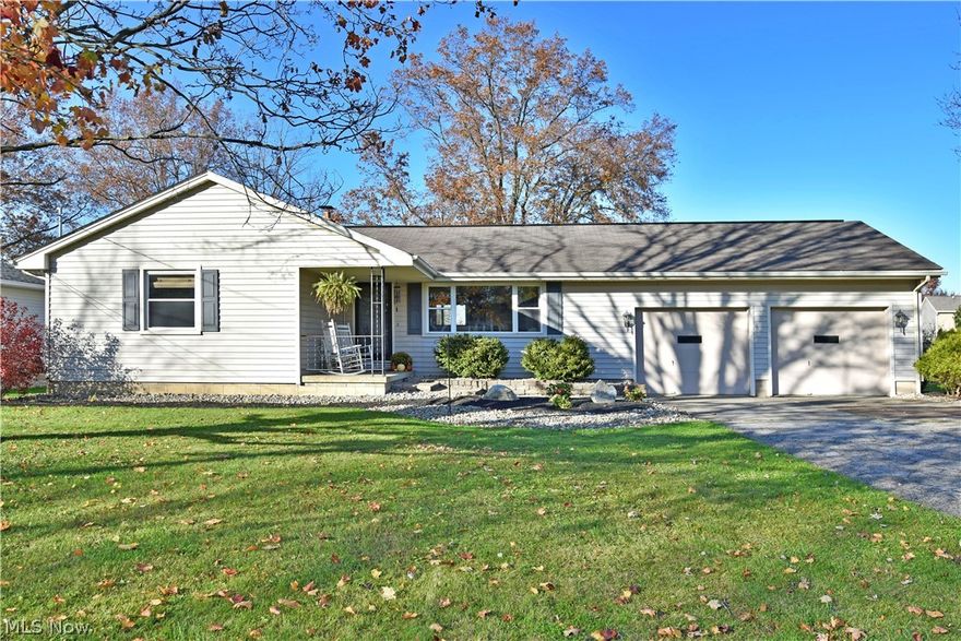 With two floors of living space and a fantastic back yard with a huge rear deck area; this tastefully updated Champion ranch checks all the boxes for you! Beautifully landscaped, the handsome residence packs plenty of curb appeal with its colorful trees and covered front patio. Inside, a posh living room takes full advantage of the massive picture window as natural light spills in over the carpeted flooring. A reveal window offers bar-top seating as it looks towards the nearby formal dining room where patio access is located. Hardwood style flooring runs below and continues into the functional, corner kitchen as countertop space takes advantage of pass-through serving. Down the main hall that wraps the home, a lovely full bath delights with a stylish vanity and large shower paired with built in cabinets. The three sun-filled bedrooms boast spacious layouts and clean, natural colors. Downstairs, a finished rec room allows for plenty of storage. Laundry and utilities await nearby.