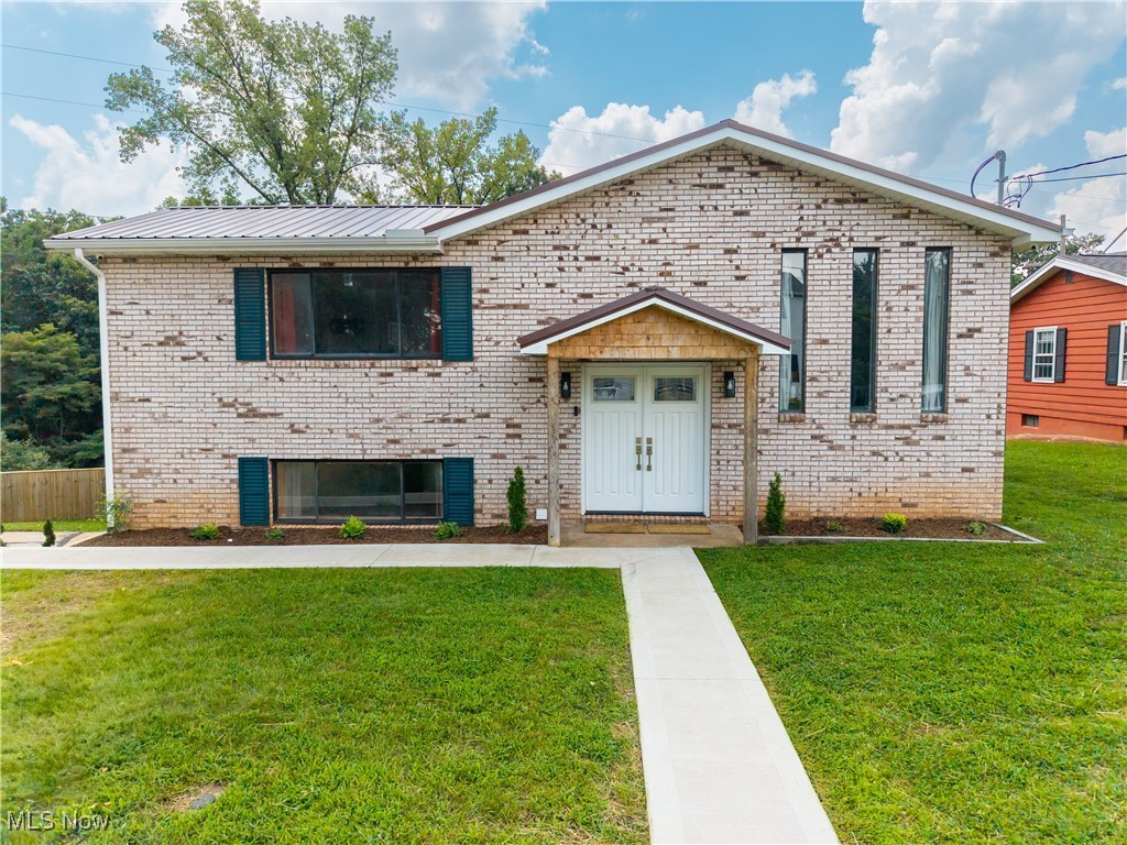 This stunning home has been completely remodeled from top to bottom and is perfectly situated on over 1.22+/- acres at the end of a quiet dead-end street, offering a peaceful setting while being just minutes from shopping, dining, and other necessities. Step inside to an inviting open floor plan featuring a spacious eat-in kitchen with an abundance of custom cabinetry, stainless steel appliances, and access to the large back deck—ideal for outdoor dining or simply enjoying the serene natural surroundings. The kitchen flows seamlessly into the warm and welcoming family room, highlighted by natural pine walls that create a cozy, rustic feel.
The lower level of the home is a true retreat, boasting a luxurious master suite complete with an electric fireplace, a spa-like master bath with a double vanity, and an oversized walk-in tile shower. The flexible floor plan also includes a fourth bedroom that could easily be used as a recreation room, office, or additional living space. A convenient mudroom is located just off the covered patio, offering easy access after enjoying the expansive backyard. The oversized backyard is fully fenced with a privacy wood fence, providing the perfect space for pets, children, or entertaining. Relax on the covered patio or unwind on the back deck while taking in the sights and sounds of local wildlife. Extensive updates include: New air conditioner (2022), New roof (2022),
New furnace (2024), Updated plumbing (2024), Upgraded 200-amp electrical service, mostly rewired with all new receptacles (2024), New water heater (2023), New windows (all but two) (2023), New siding (2023), New appliances (2023), Brand-new trim, doors, flooring, paint, drywall, kitchen, and two full bathrooms (2024). This home offers the perfect blend of privacy, convenience, and quality craftsmanship. The sellers are sad to part with this beautiful property, but are relocating, making this a rare opportunity for a fortunate buyer.
