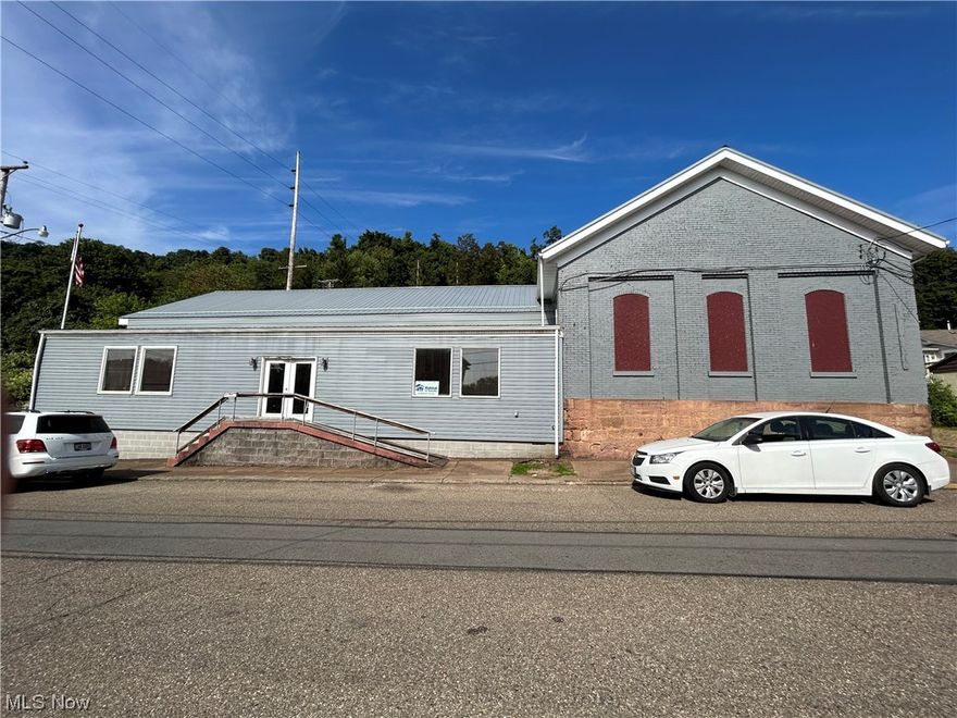 Buy it while you can! Opportunity to own your own building!  Building has a large reception room when you enter and also another reception room in rear of building.  3 meeting rooms, 2 offices and 2 bathrooms.  Plus lots of additional storage area.  This building has incredible space for your office and business needs and is just off of I70 also near West Virginia if commuting. There is parking in the front and also in the rear of the building.  This building is being sold as is with right of inspection.  Check with city for use of building.  Come and take a look@  Located on a corner lot in Aetnaville.