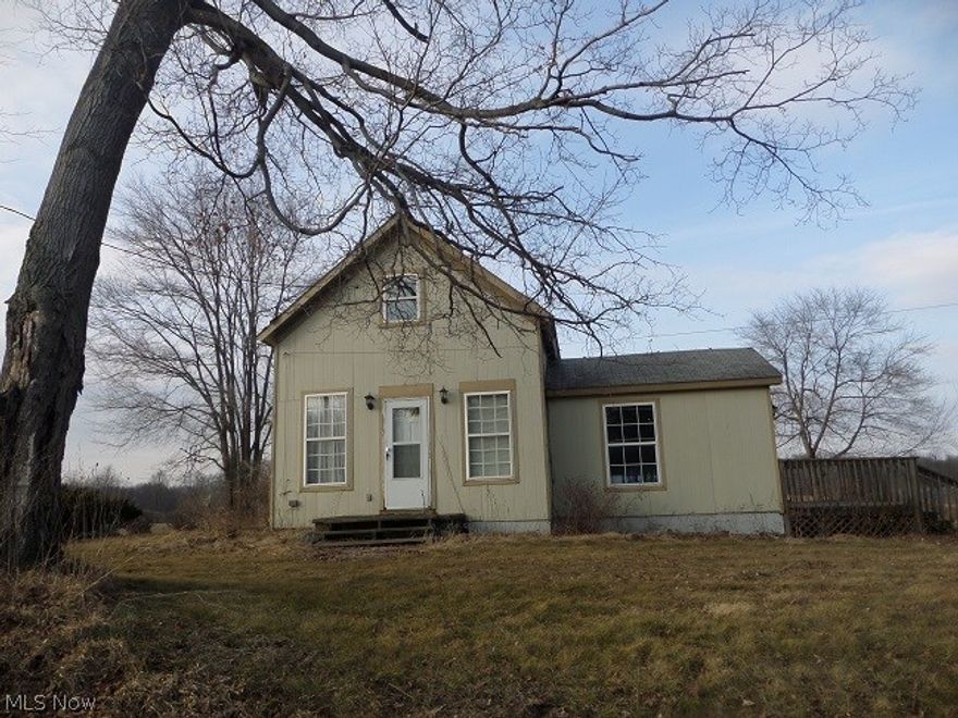 This is the most beautiful property listed in a long time! You can do so much living on this property!  The view is amazing! Nice open rolling land with a large pond for fishing, ice skating, ice fishing, canoeing or anything you'd like! Have a blast with your 4 wheeler's or snowmobiles! There is a 2 bedroom, 2 story home on the property that is in need of work. First floor laundry area is in the large full bath. Spacious bathroom, kitchen and living rm! The upstairs has two bedrooms or one large one. Nice built in shelves for your closet! This home could be so cute finished and repaired! The value is in the land. Would make a great building site for a new home if you wanted to tear down the existing home. Basement is full of water. Please do not try to enter it.  Special assessment is $18.45 10-699 Storm Water district $18.45 for the full year.  Owner does not own mineral rights. Bank has set $53,000 as the purchase price but please submit any reasonable offer!