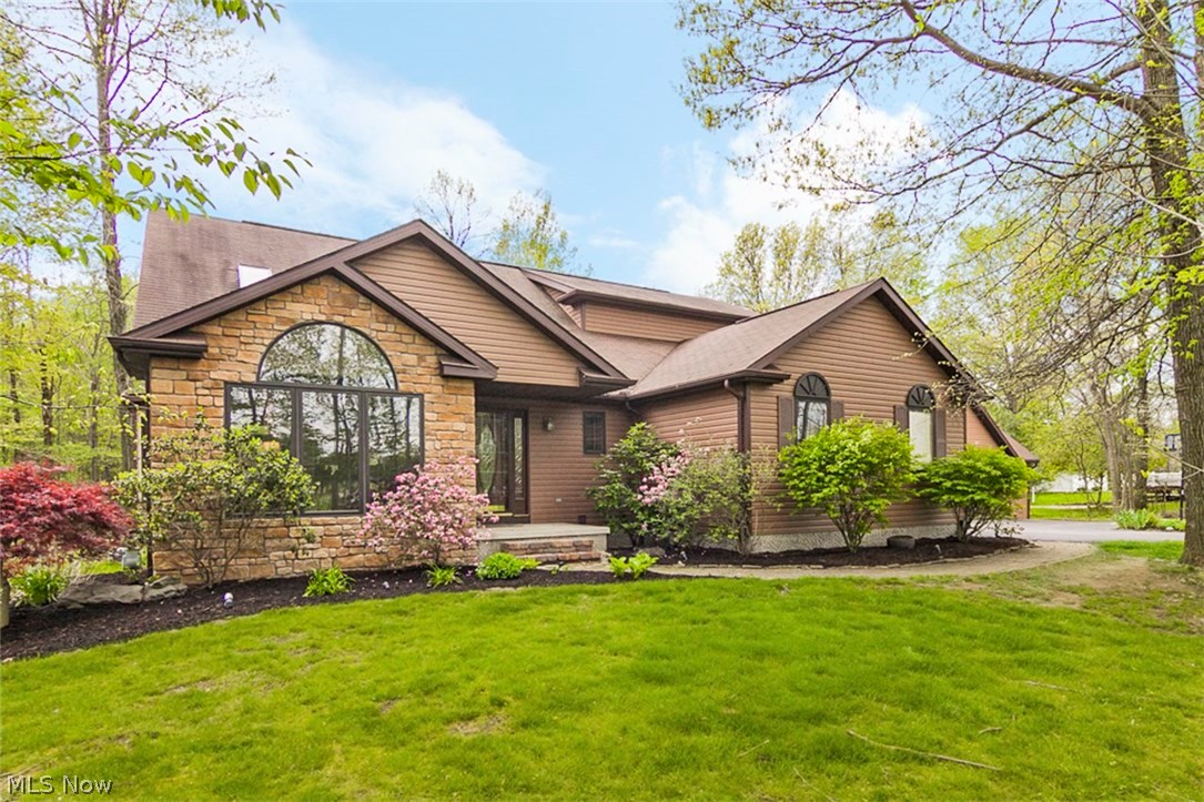 Welcome home to your private retreat on 2+ acres in a highly desired neighborhood. This home is 2800+ square feet with a full walk out basement. Featuring a large curved staircase, the foyer inside welcomes you and your guests to the beautiful open floor plan with a spacious kitchen and abundant natural light. Enjoy a cup of coffee around the oversized kitchen island looking through the large windows to the wooded lot. Don’t miss the Elan oven, the Jenn-Air cooktop, the cherry cabinets and 3 sided gas fireplace. The 3 bedrooms are upstairs, and the master bedroom features a built in corner Jacuzzi whirlpool and its own ensuite bathroom with a full walk-in closet. One of the best aspects of all though is the 2.5 car heated garage and the detached 3.5+ car garage with a loft and skylights. There is a possible 4th bedroom in the basement, with plenty of extra storage space as well. Don’t hesitate to call!