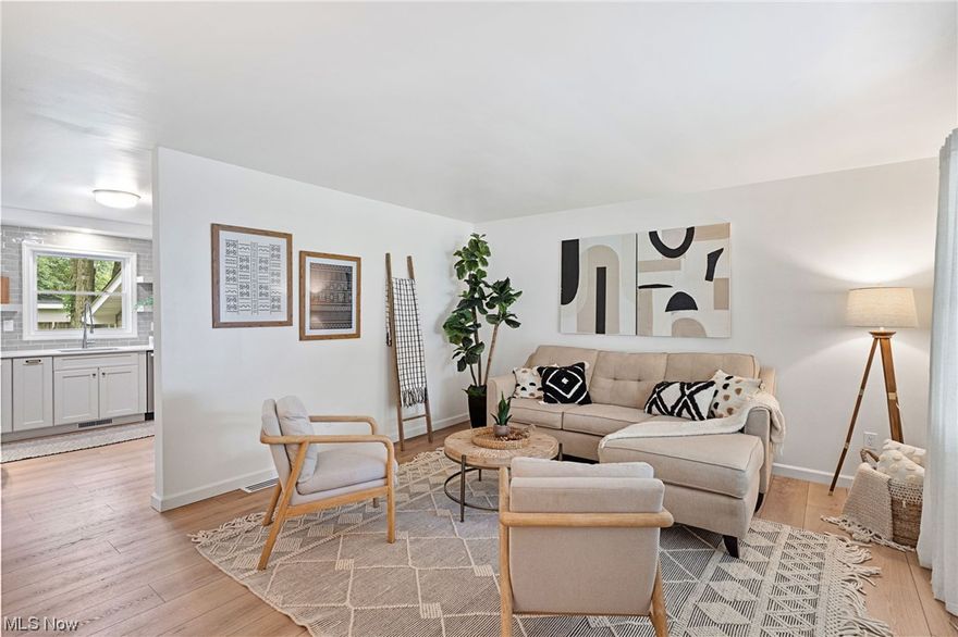 Welcome to your dream home! Situated on a corner lot, this fully renovated ranch home is sure to amaze with its stunning beauty and incredible features. With neutral tones throughout, every room exudes a sense of elegance and tranquility. Step inside and be greeted by the cozy living room, perfect for relaxing at the end of the day or watching your favorite show. Be amazed at how big this ranch is as you enter the gorgeous kitchen, featuring quartz counter tops and Kraftmaid cabinets, which flows gracefully into the dining room with French doors leading out to the patio. Off of the dining room you will find a bonus room perfect for a multitude of uses, with big windows to bring in the natural light. This end of the home also features a 1/2 bath with custom wainscotting and high ceilings. On the other end of this sprawling ranch, you will find 2 bedrooms, and a beautifully tiled full bathroom. That's not all! Wait until you see the master suite and its stunning master bath with quartz t