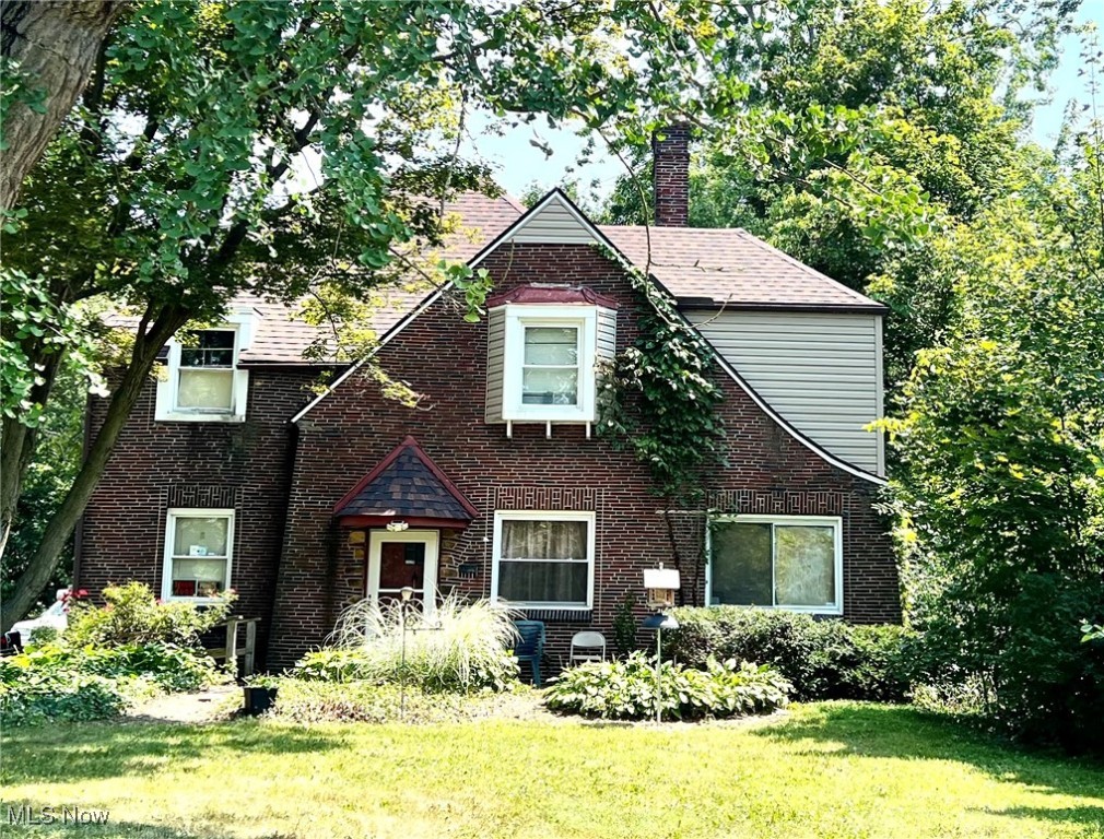 Discover the timeless appeal of this classic Tudor-style home, brimming with original charm and rich potential. Featuring hardwood floors throughout two stories and a finished attic space, this home also boasts beautiful original woodwork that adds warmth and character to every room. With a little TLC, this residence is a wonderful investment opportunity or restoration project, ready to be restored to its former glory. What truly sets this property apart is the side lot—a peaceful retreat that includes a lovingly planted orchard with plum, apple, and peach trees, along with grape vines—each thoughtfully planted in honor of cherished family members. It’s a unique and personal touch that makes this property feel like home the moment you arrive. A rare opportunity to own a piece of history with space to grow—literally and figuratively. Property is being sold "As Is" Seller will make no repairs.