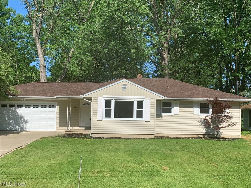 This ranch home has been recently updated from top to bottom but still has the solid classic construction with modern touches and fantastic good looks.  iThe quiet Champion neighborhood is attractive to families or people down sizing.the residence sits on an ample lot, with a semi wooded backyard, creating a scenic and private setting.  Clean natural colored siding is accented by white trim work as the new roof is can be seen from above. Inside, a visual treat awaits as you take in the soothing gray and white colorways that fill each wall. Dark hardwood style flooring reflects the natural light pouring in from the large picture window in the central living room. The inviting kitchen showcases gorgeous ash colored flooring that fills the adjacent eat in dining area. Stone look countertops compliments the fresh white cabinets and stainless appliances. A short hall opposite the living room branches off into the three sizeable bedrooms. Each containing the signature flooring and personal c