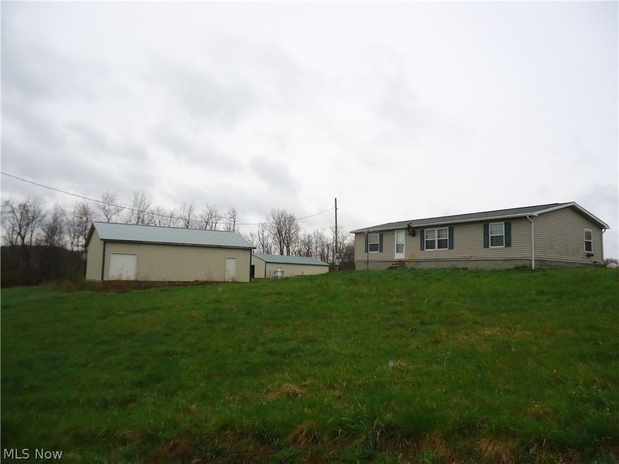 Looking for seclusion in Beaver Local School District? Look no further, this home sits back way from the street with trees between the road and property. Everything on one level with 3 bedrooms and two full baths. Master bedroom features 2 closets and master bath with double shower. Home is heated with a propane furnace and a wood burner in the living room. Detached 30 x 40 2 car garage with electric and work area in rear.  Also included on this 9.223 acres is a fenced pasture with 30 x 60 barn with water. Pond located further back on the property. Mineral rights are not included.