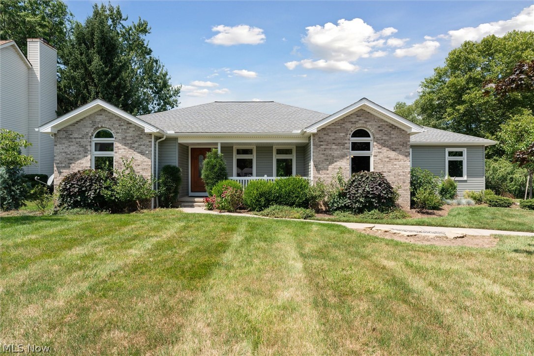 Move-in ready, one-owner ranch home in a desirable location, close to all amenities and shopping, and in an established neighborhood! The front walk leads to a covered front porch and a centrally placed entry foyer with a view to the spacious rear patio and garden. It opens to a large living room and a formal dining room which can also be used as a study/office. Off the dining is a fully equipped eat-in kitchen that can also be accessed with a hallway from the living room. The completely remodeled kitchen with all new appliances (2015) is easily accessed from the garage through a mud-room/laundry room and boasts custom cherry cabinets, quartz countertops, well-made cabinetry with soft-close drawers, plenty of storage cabinets, and a coffee-making/toaster station! The primary bedroom is private from the rest of the home and is filled with natural light. It has an en-suite primary bedroom with a separate tub and walk-in shower, and a generous walk-in closet. To the other side of the home are two bedrooms that share a common full bath and are accessed from a private hallway. Desirable features include brick façade, a beautiful fireplace and mantel in the living room, vaulted ceiling and arched window in bedroom and breakfast nook, Mirage maple engineered hardwood floors in the living areas, newer Renewal by Anderson windows and sliding door (2015-2022), transom windows in the primary bedroom, generous closets throughout, security system with smoke detectors hardwired and tied into it, clean basement with a workshop area and cabinets, concrete driveway, a generous side-facing garage with new garage door, opener and keypad (2018), new roof (2017), new siding, gutters and downspouts (2022), tankless water heater (2010), recent energy audit with just completed recommendations (2021), established perennials around the home, and a full privacy fence! Schedule your virtual or in-person tour today!