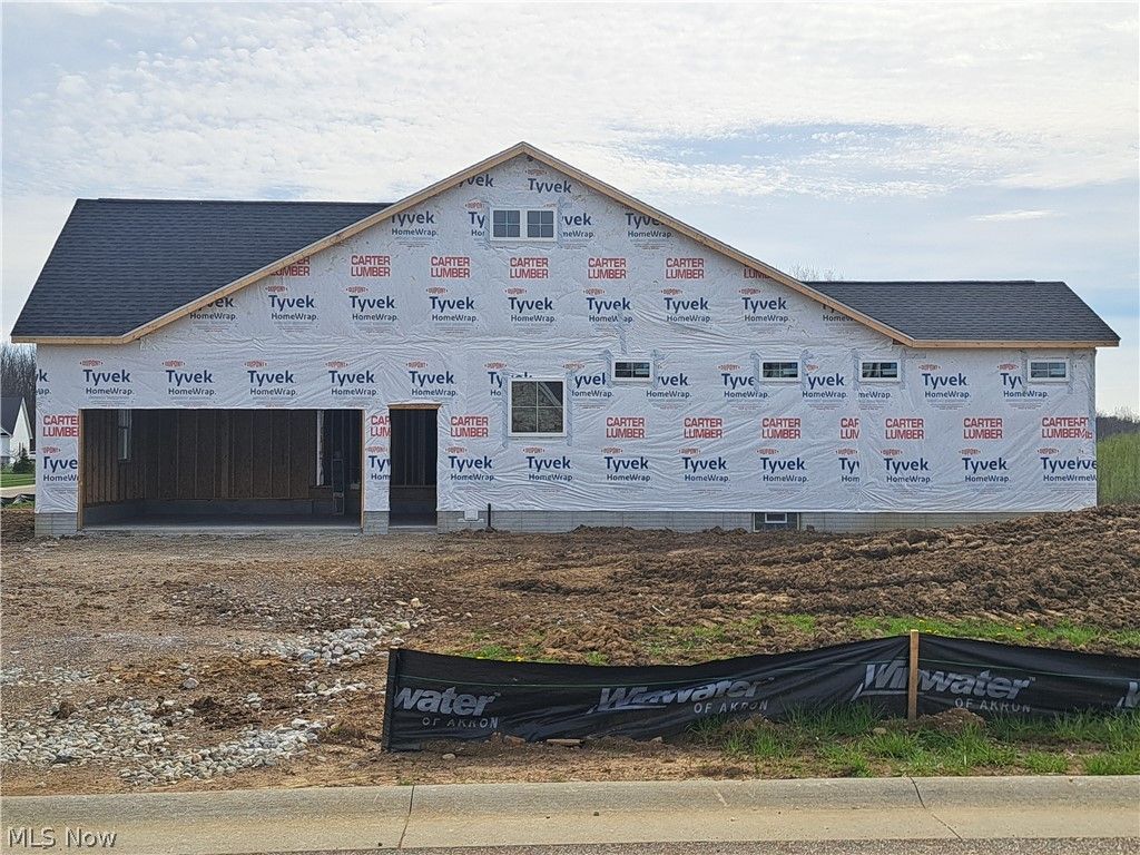 Photo of 547 Woodlands Glen Avenue, Hartville, OH 44632 (MLS # 5201074)